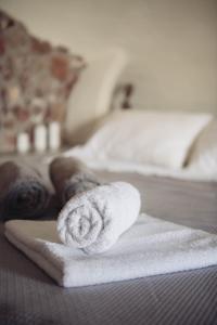 A bed or beds in a room at Santorini Villas