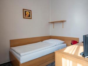 Ένα ή περισσότερα κρεβάτια σε δωμάτιο στο Hotel Olympia Česká Lípa