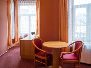 Χώρος καθιστικού στο Hotel Olympia Česká Lípa