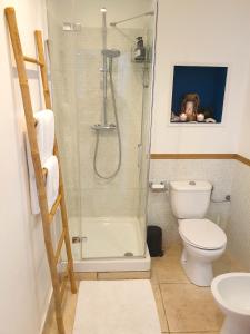 a bathroom with a shower and a toilet at Bright Loft in Cannes +9 photos