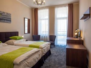 Ένα ή περισσότερα κρεβάτια σε δωμάτιο στο Hotel Olympia Česká Lípa