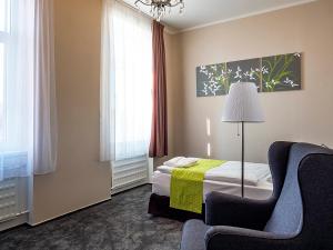 Ένα ή περισσότερα κρεβάτια σε δωμάτιο στο Hotel Olympia Česká Lípa