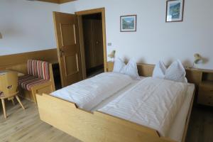 A bed or beds in a room at Residence Scheidnerhof