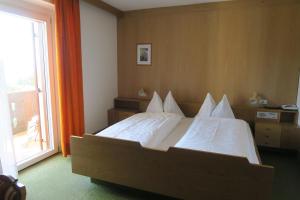 A bed or beds in a room at Residence Scheidnerhof