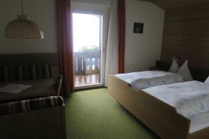 A bed or beds in a room at Residence Scheidnerhof