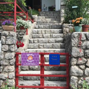 a set of stairs with signs on them at Apartman Cvenkica in Omišalj