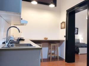 a kitchen with a sink and a counter top at Brand New Apartment in Sulmona in Sulmona