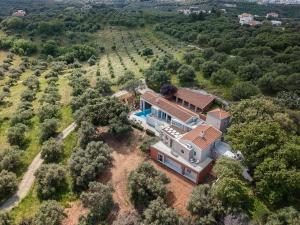 an aerial view of a house in the middle of a field at Vilia, House on the Hill in Chania Town