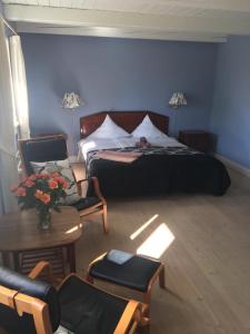 Een bed of bedden in een kamer bij Lerbæk Hovedgaard