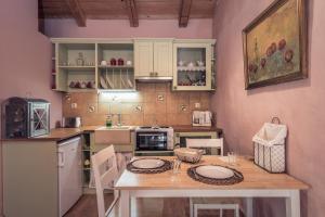 a kitchen with a table with two plates on it at La Casa Di Nonna in Koríthion