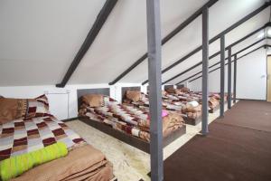Postel nebo postele na pokoji v ubytování Sheni Hostel