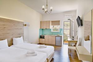 Posteľ alebo postele v izbe v ubytovaní Emmanouela's Apts