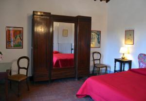 Postel nebo postele na pokoji v ubytování Locanda di Praticino