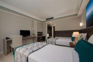 Cama ou camas em um quarto em Wish Natal