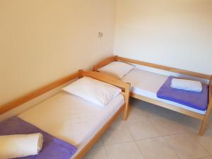 Postel nebo postele na pokoji v ubytování Apartments Margita