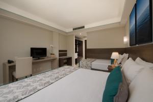 Cama ou camas em um quarto em Wish Natal