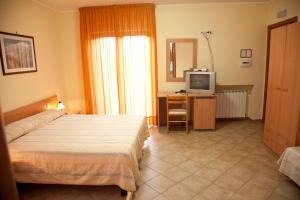 Ένα ή περισσότερα κρεβάτια σε δωμάτιο στο Caffè Nuovo 2 Holiday Rooms