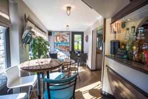 a restaurant with tables and chairs and a bar at Mary Boat Trip in Ile aux Moines
