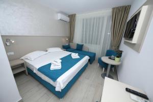 Postel nebo postele na pokoji v ubytování Hotel Delfin