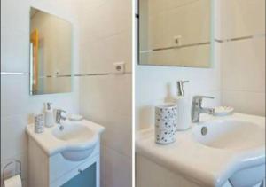 a bathroom with a sink and a mirror at Cosy Santa Catarina Flat in Porto