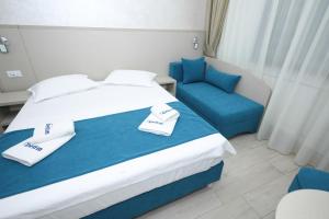 Postel nebo postele na pokoji v ubytování Hotel Delfin