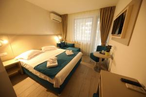 Postel nebo postele na pokoji v ubytování Hotel Delfin