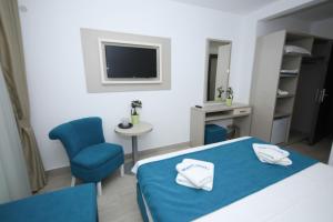Postel nebo postele na pokoji v ubytování Hotel Delfin