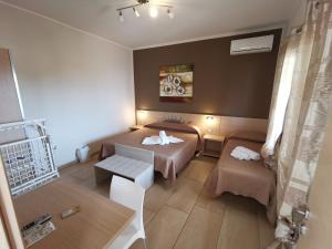 Postel nebo postele na pokoji v ubytování Samanà B&B con Spiaggia Privata a Punta Prosciutto