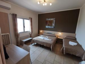 Postel nebo postele na pokoji v ubytování Samanà B&B con Spiaggia Privata a Punta Prosciutto