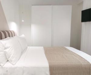 Posteľ alebo postele v izbe v ubytovaní SuitesGaribaldi