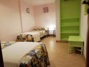 A bed or beds in a room at Villa Pula Viñas Country villa 3 bedrooms pool and fabulous views of the Pula golf course near Son servera