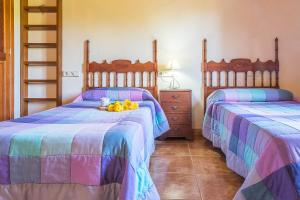 A bed or beds in a room at Villa Pula Viñas Country villa 3 bedrooms pool and fabulous views of the Pula golf course near Son servera