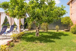 A garden outside Villa Pula Viñas Country villa 3 bedrooms pool and fabulous views of the Pula golf course near Son servera