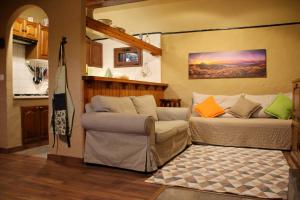 a living room with a bed and a couch at Casa Tajinastes del Teide in Las Canadas del Teidn