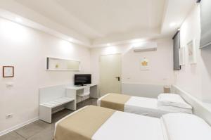 TV a/nebo společenská místnost v ubytování Hotel Tempio Di Pallade