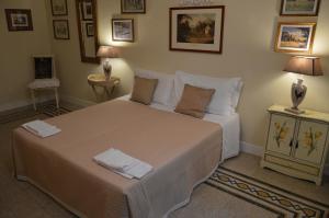Ένα ή περισσότερα κρεβάτια σε δωμάτιο στο Paola A Trastevere