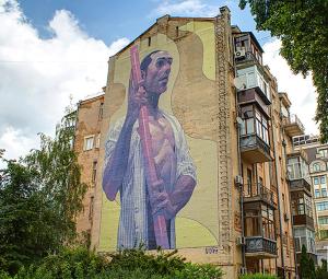 a mural on the side of a building at Home Hotel Apartments on Mykhailivska Square - Kiev in Kyiv