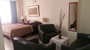 Postel nebo postele na pokoji v ubytování HOTEL COSTA DEL SOL FUSAGASUGa