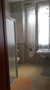 a bathroom with a shower and a sink at ALEX CITY INN III in Rome