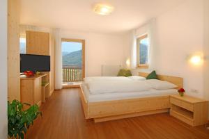Postel nebo postele na pokoji v ubytování Pension Auerhof