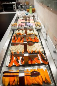 a buffet line with many different types of food at Matiz Manhattan in Sao Paulo +55 photos
