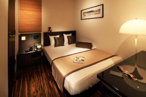 Postel nebo postele na pokoji v ubytování Hotel UNO Nishikawaguchi Nishiguchi