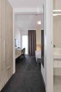 Кровать или кровати в номере Hotel Mediteran