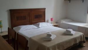 A bed or beds in a room at Casa di Alfredo Affittacamere
