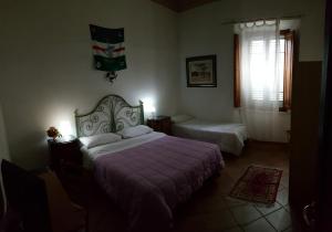 A bed or beds in a room at Casa di Alfredo Affittacamere