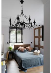 Säng eller sängar i ett rum på Gostynin Garden Apartment