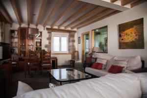 a living room with a couch and a table at La Casa de Santa Olalla in Molledo