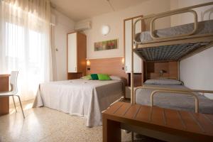 Postel nebo postele na pokoji v ubytování Hotel Veliero