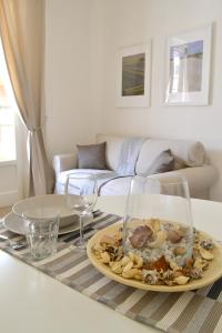 a plate of food on a table in a living room at Modarno Exclusive Apartments in Florence