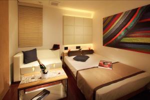 Postel nebo postele na pokoji v ubytování Hotel UNO Nishikawaguchi Nishiguchi